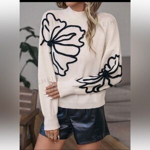 Sweater with flower appliqué